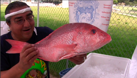 Roberto San Miguel holds a Red Snapper